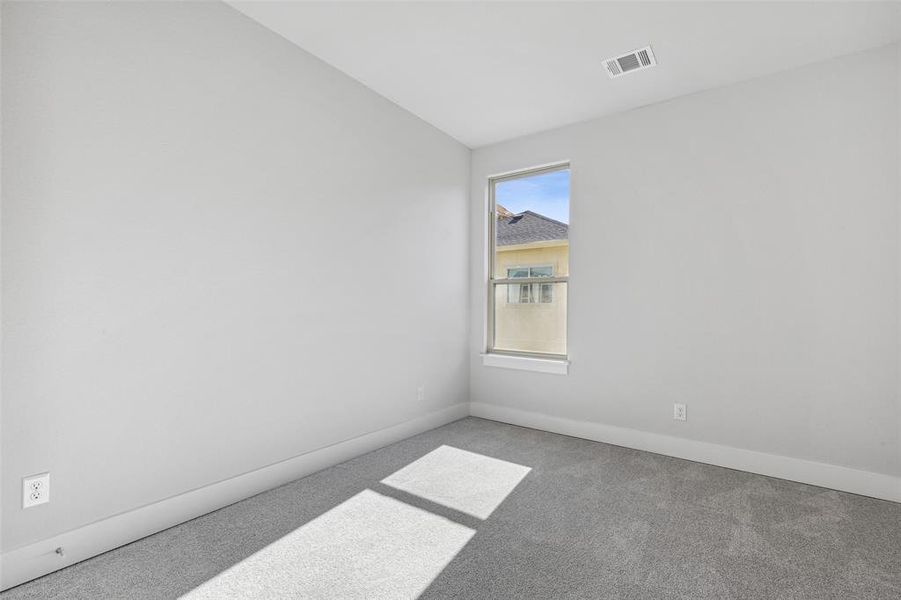 Unfurnished room with carpet flooring