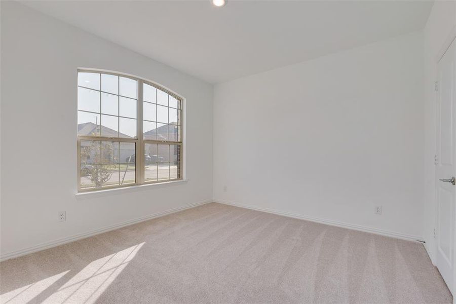 Unfurnished room with carpet floors