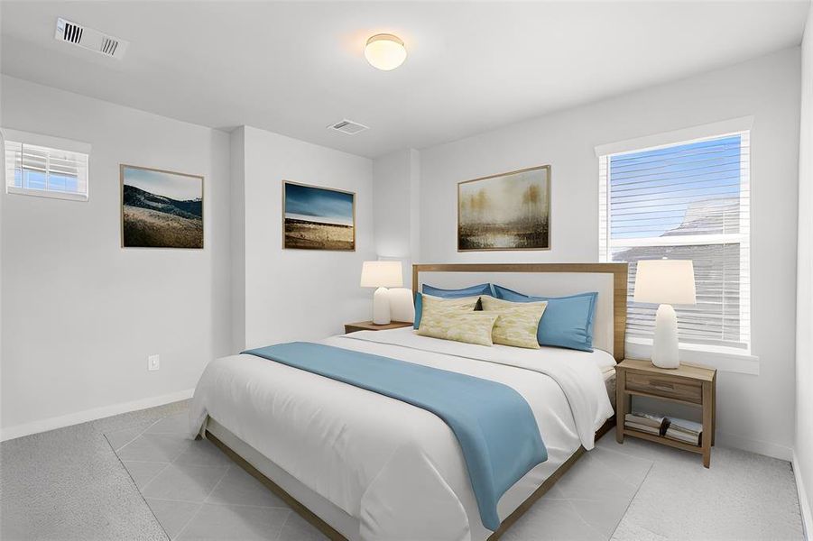 Secondary bedroom features plush carpet, custom paint and a large window with privacy blinds.