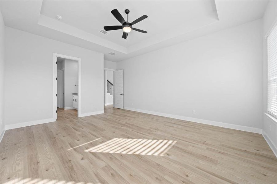 Master bedroom is downstairs with stunning vinyl flooring.