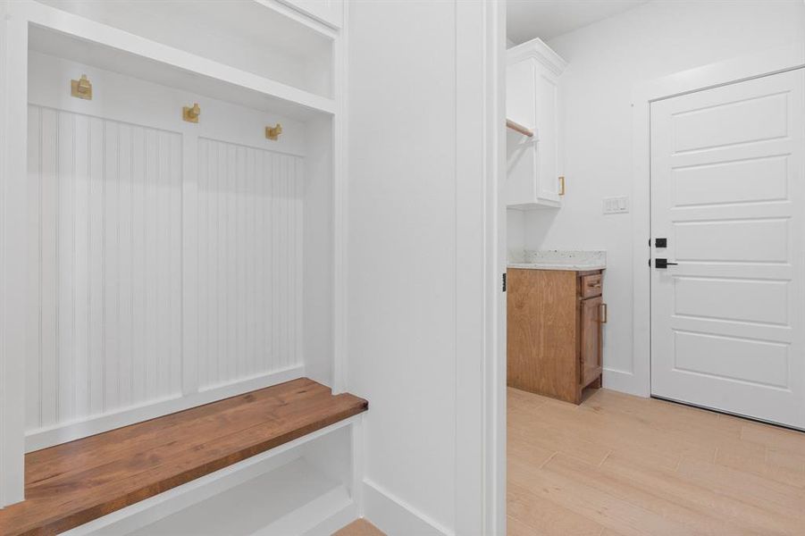 Mud room near laundry room