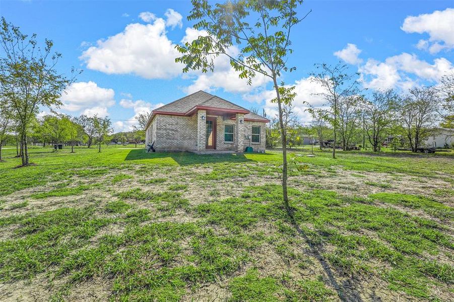 View of back of home with plenty of room for many Homestead projects