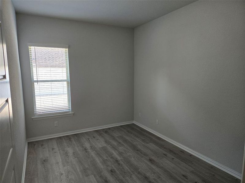 Empty room with wood-type flooring