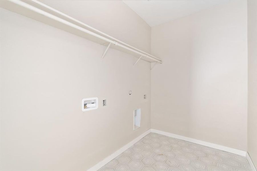 Laundry room with hookup for a gas dryer and hookup for a washing machine