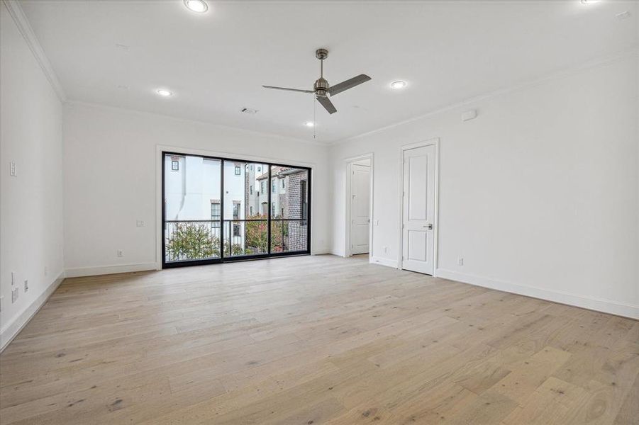 Game room up with sliding stacking doors to the balcony