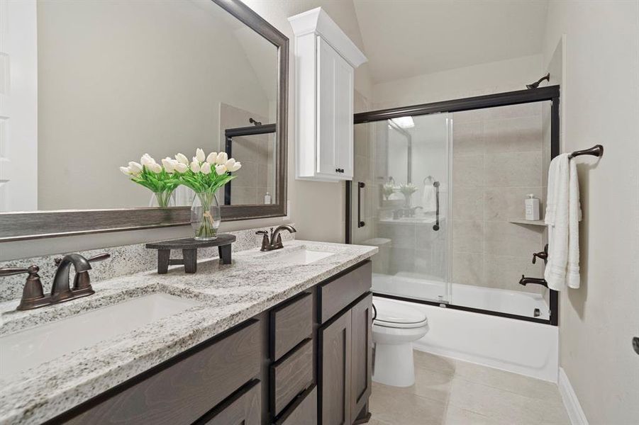 Dual vanities in secondary bathroom makes it easy to share