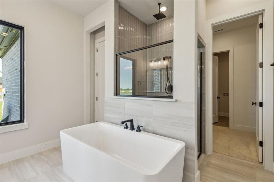 Bathroom featuring independent shower and bath