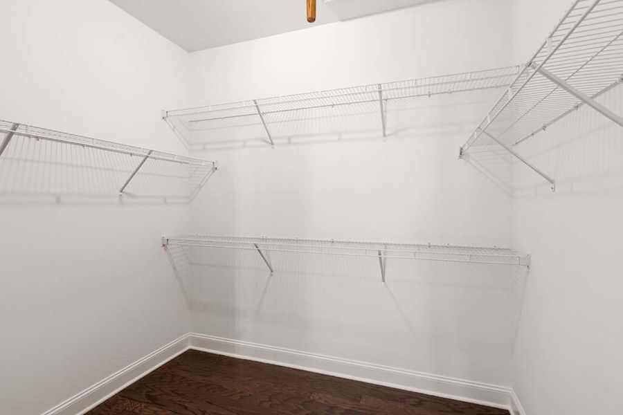 Sample Primary Bedroom Walk-in Closet Photo: Actual selection and features may vary.