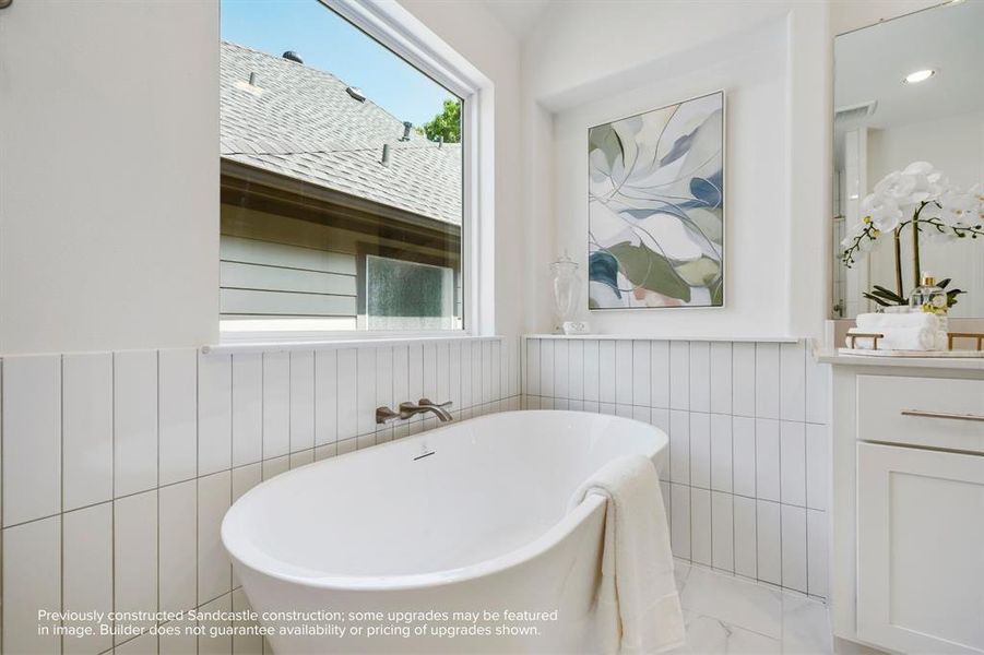 Soak in Serenity: End your days or start your weekends enveloped in the embrace of a luxurious soaking tub in this exquisitely designed primary bathroom.