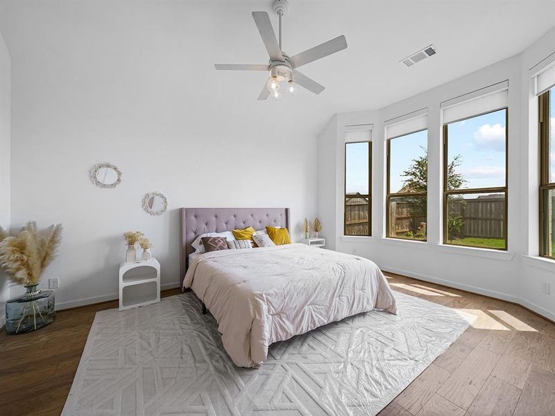 Step into your dream sanctuary with this gorgeous primary retreat! Bathed in natural light from a stunning bay window, this spacious haven offers ample room for a king-size bed and all your favorite furnishings.