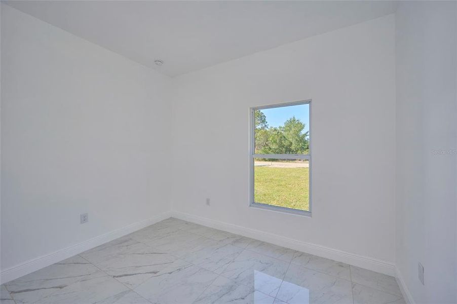 One of two secondary bedrooms