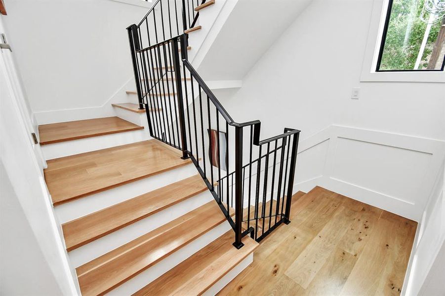 Elegant Stair Case to  3rd floor where you will find the luxurious primary suite and additional bedroom with full bath.