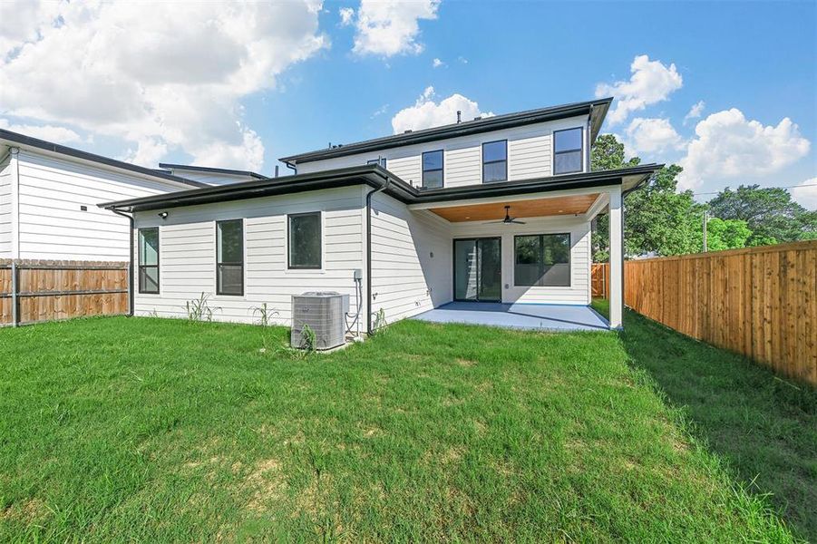 Back of house featuring a patio, cooling unit, a lawn, and ceiling fan