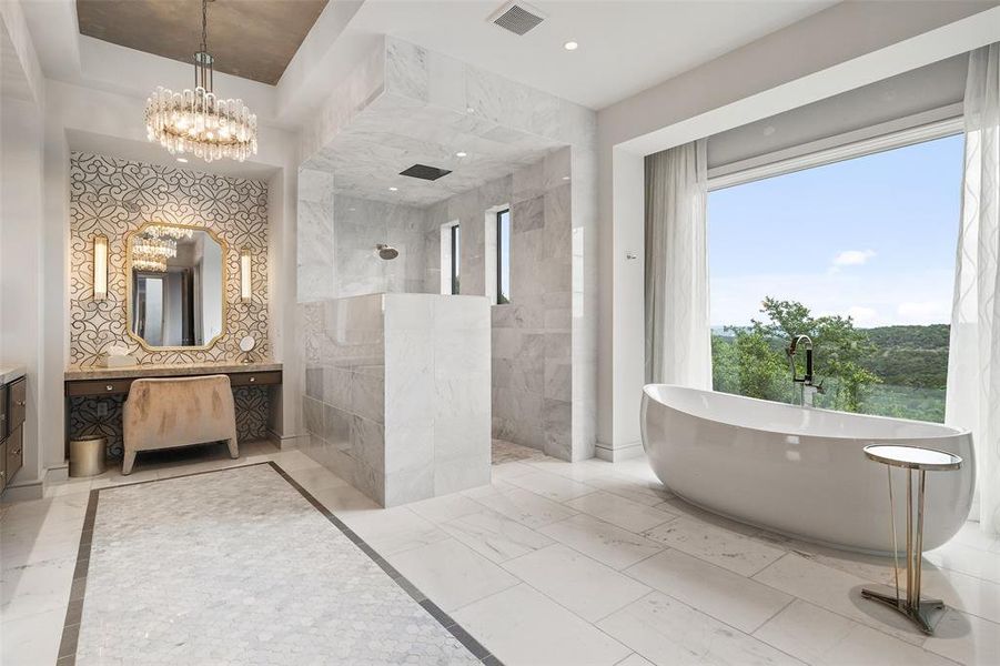 Immerse yourself in the ultimate spa-like retreat within the primary bathroom, where a lavish soaking tub invites you to indulge in moments of relaxation and rejuvenation.