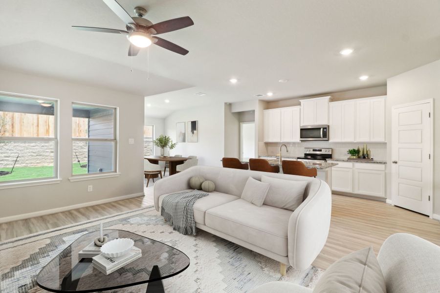 Virtually staged living room and dining room in the Callaghan floorplan at a Meritage Homes community.