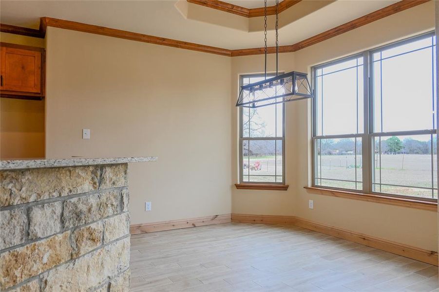 Enjoy your meals in this spacious dining room with wall of windows for tons of natural light.