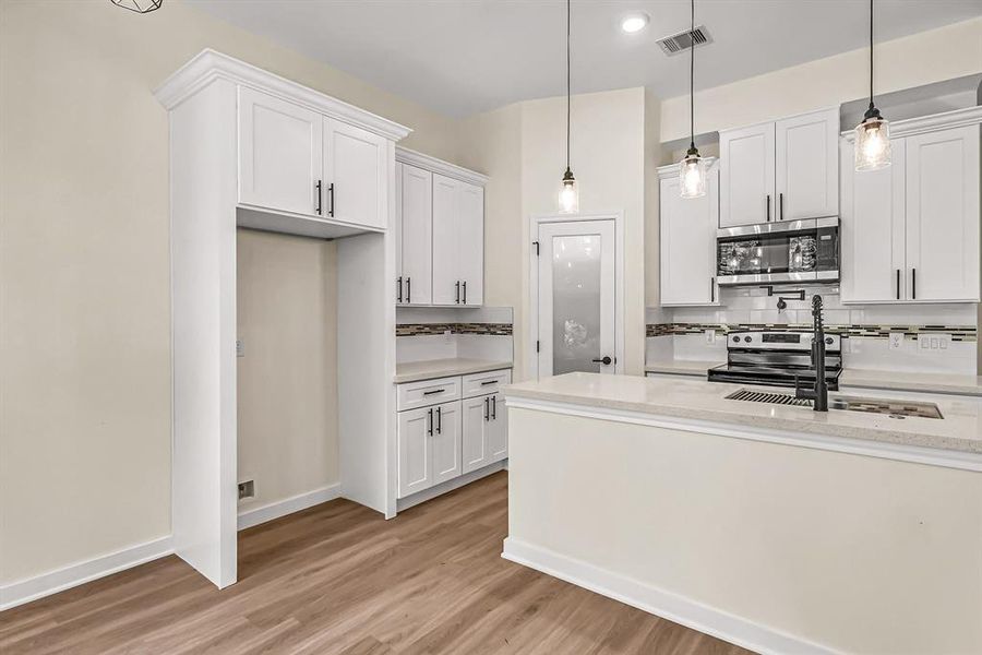 Additional storage above the refrigerator.