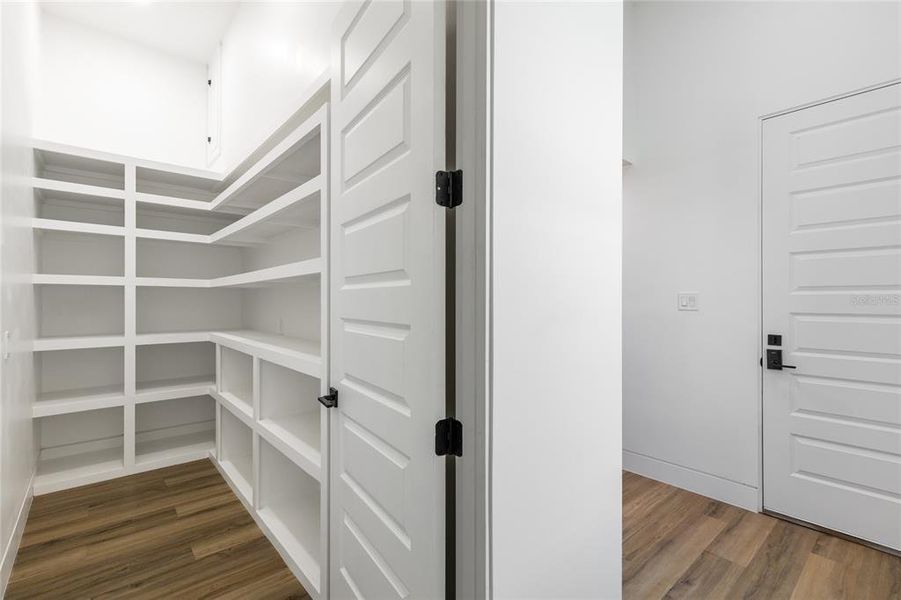 Walk in Pantry with custom built wood shelving