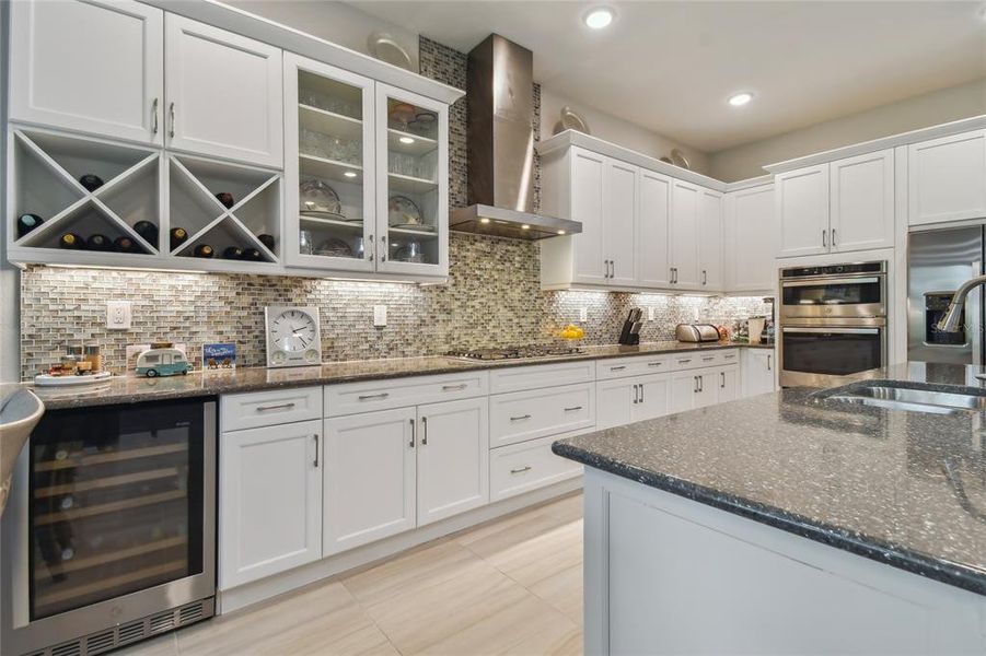 Gourmet kitchen with gas appliances and wine cooler fridge