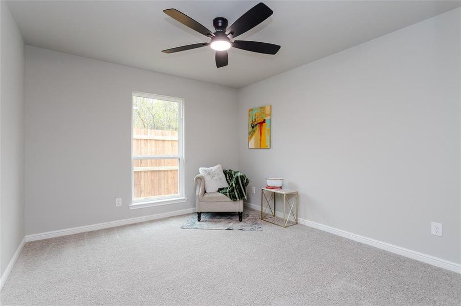 Sitting room with carpet floors and ceiling fan