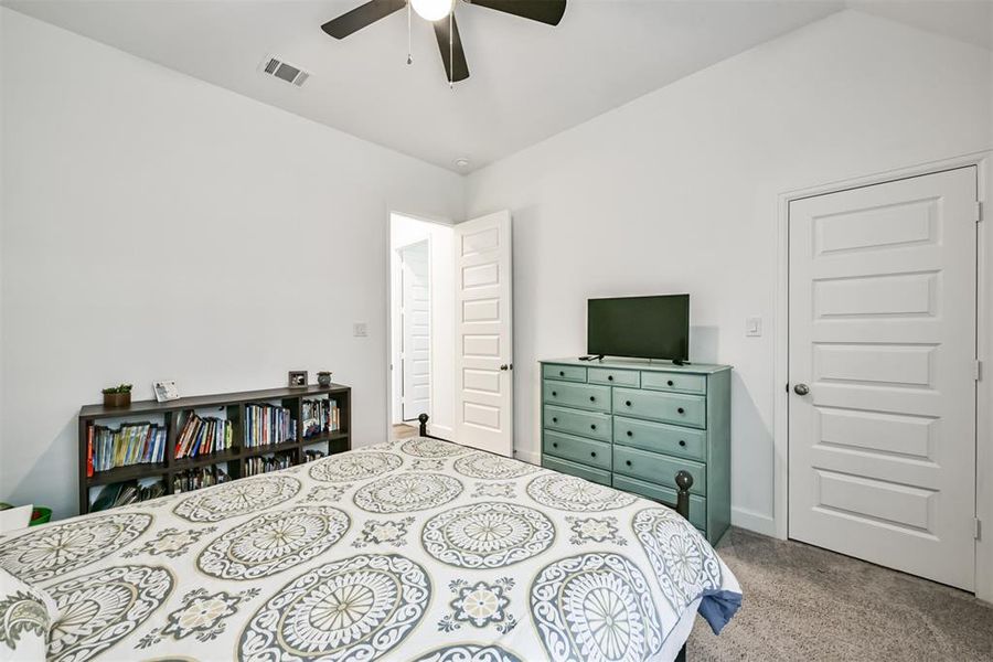 Third bedroom features awindow and plush carpet.
