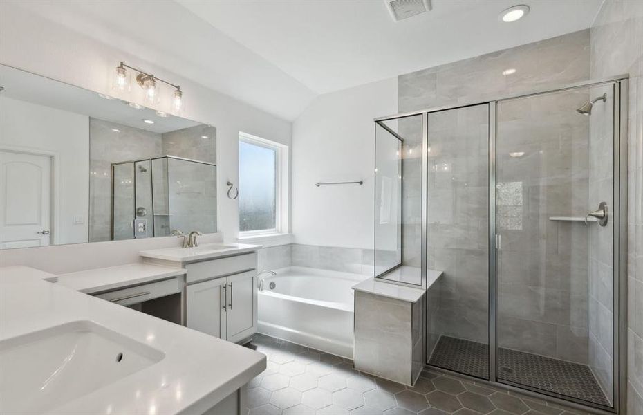 Elegant owner's bathroom with dual vanity *real home pictured