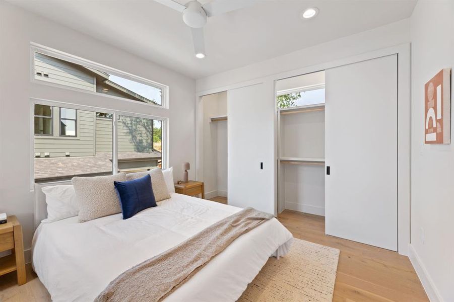 Primary bedroom with double closets.