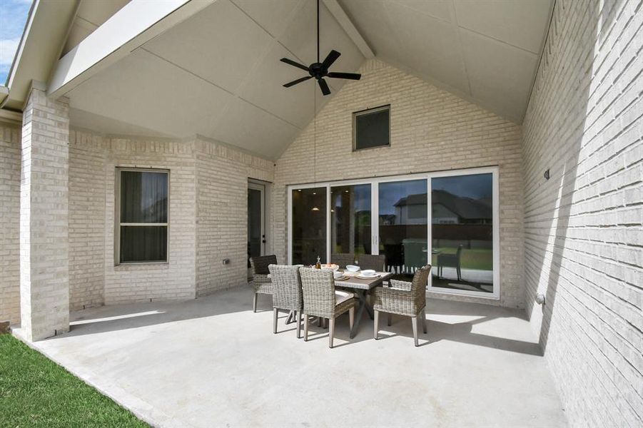 Extended covered patio, pre-wired for sound, perfect for outdoor entertainment.