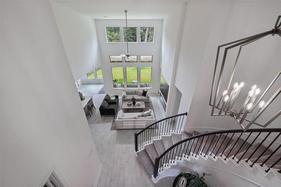 Great view down to the pretty living and spiral staircase.