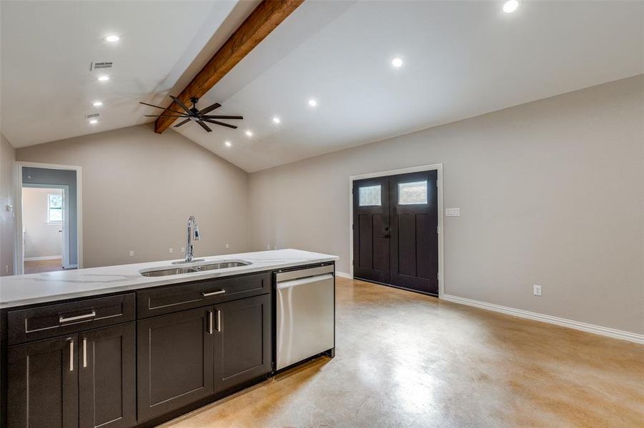 View from kitchen to front door and living area