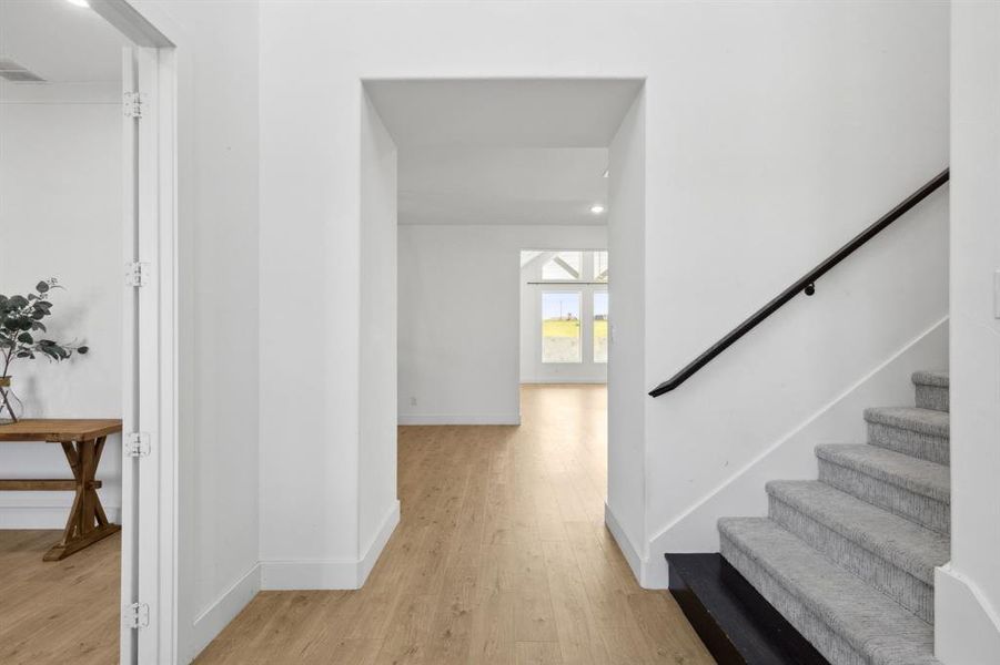 Entrance foyer featuring light hardwood / wood-style floors