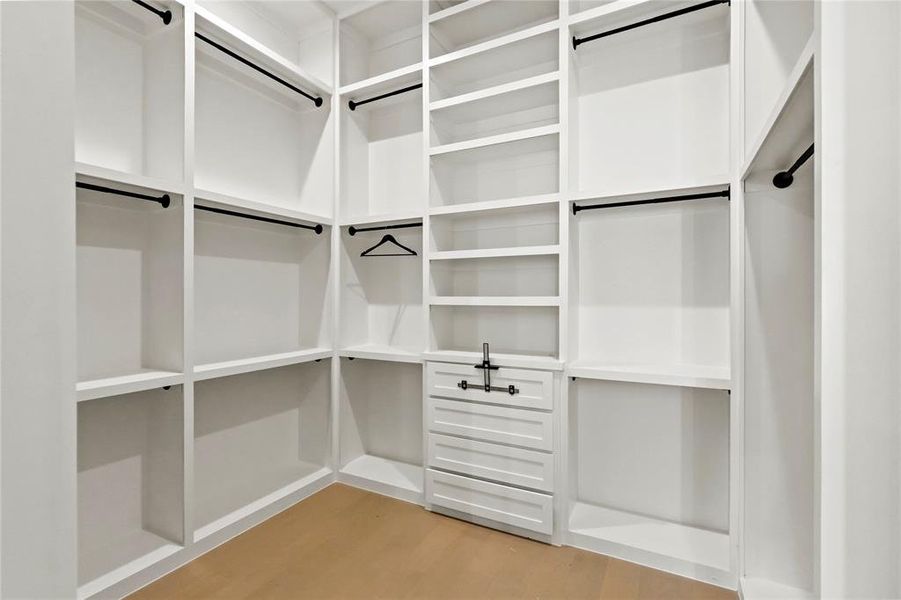 Walk in closet featuring light wood-type flooring