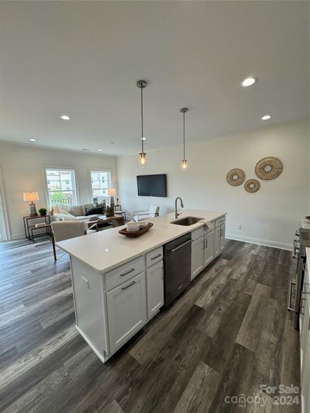 Open Concept Kitchen with Large Island and Bright White Cabinets