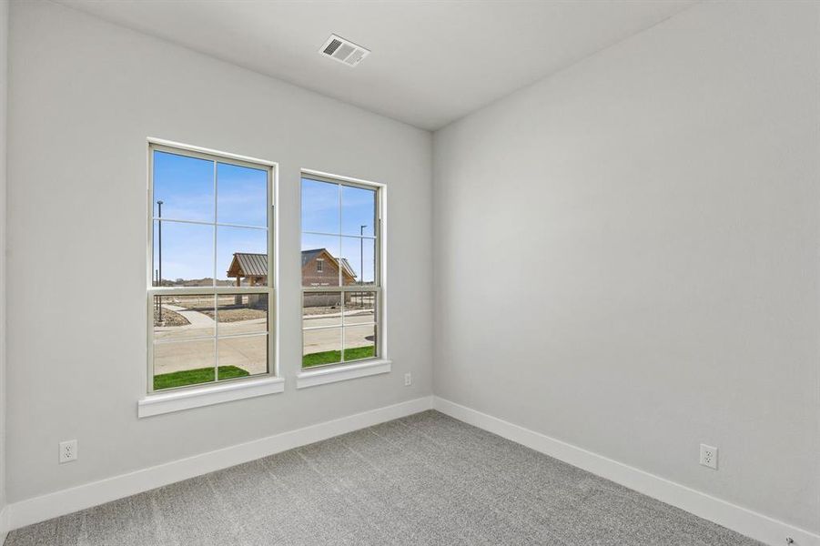 View of carpeted spare room