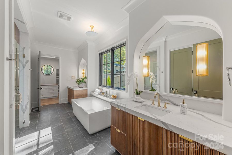 Dual vanities and large soaking tub in the spa-like bathroom