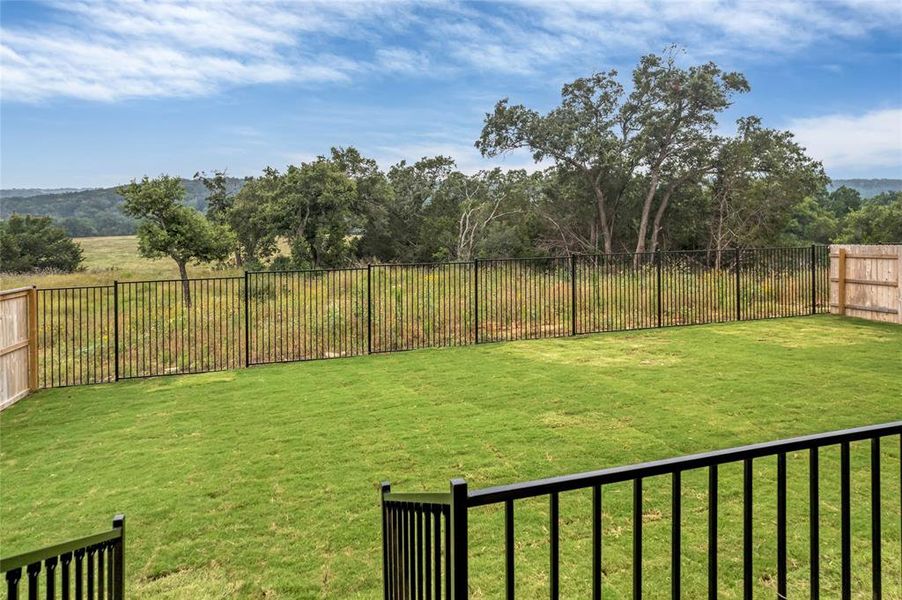 Wrought iron fence at the back offers amazing views of hill country and wildflowers.