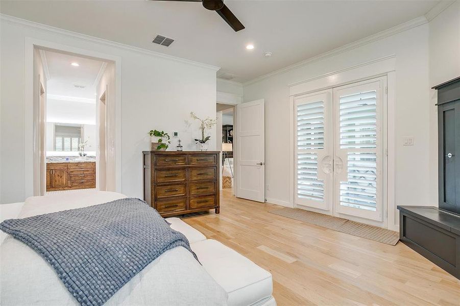 French doors in the master bedroom leading to the back patio.