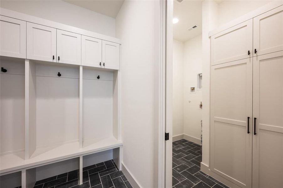 Laundry day is easy thanks to utility areas on both floors.