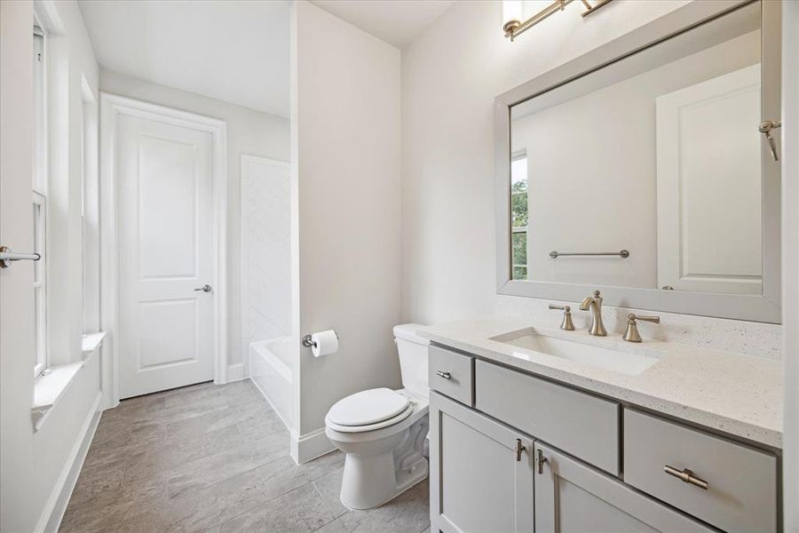 Elevate your daily routine in the secondary baths, where contemporary design elements create an indulgent experience. With sleek finishes and a spacious layout, this secondary bathroom is as practical as it is beautiful.