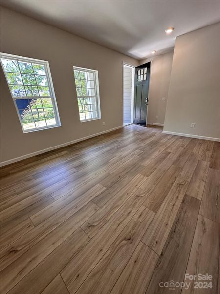 FIRST FLOOR FEATURES THE FLEX SPACE WHICH IS PERFECT FOR A IN HOME OFFICE SPACE.