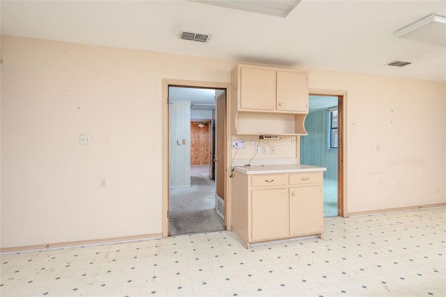 Kitchen with cream cabinets