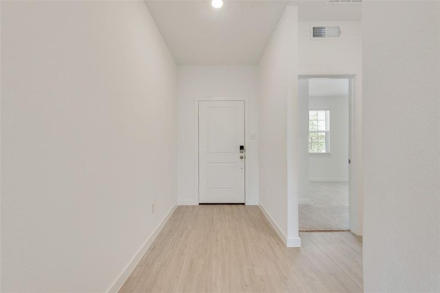 Hallway featuring light hardwood / wood-style floors