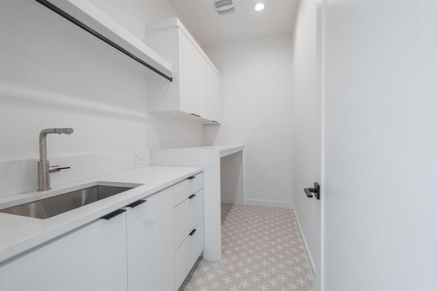 Laundry area with sink