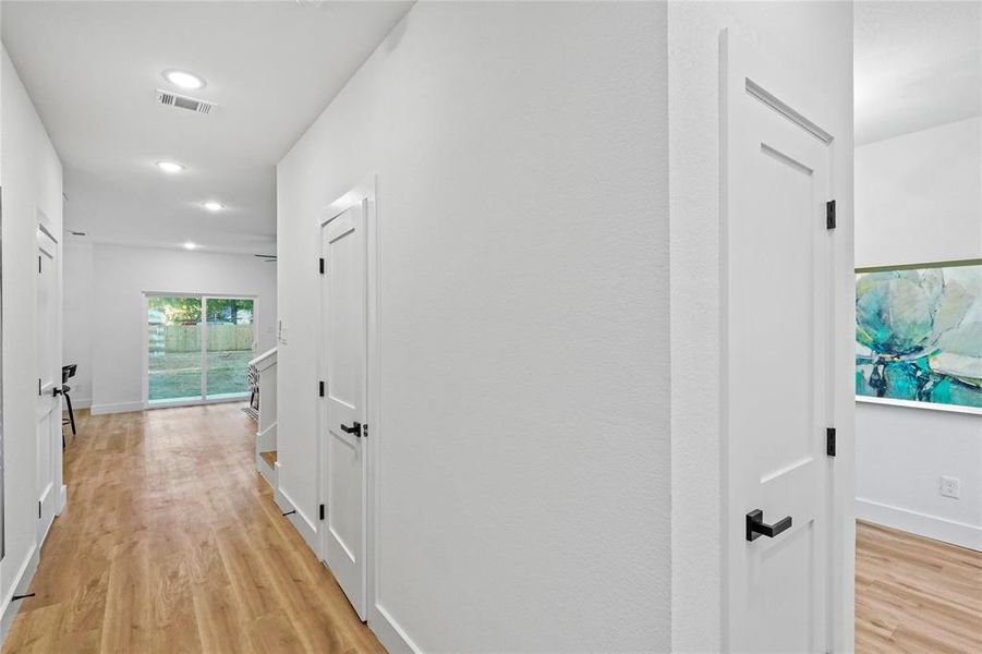 Hallway with light wood-type flooring