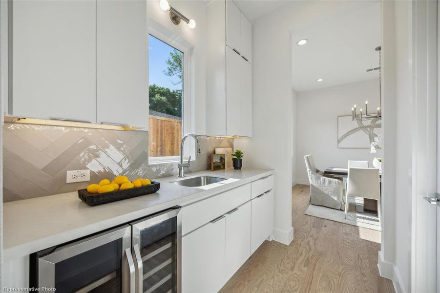 Butlers pantry with sink and wine cooler