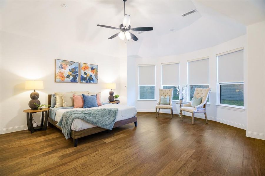 Bedroom with ceiling fan and dark hardwood / wood-style floors