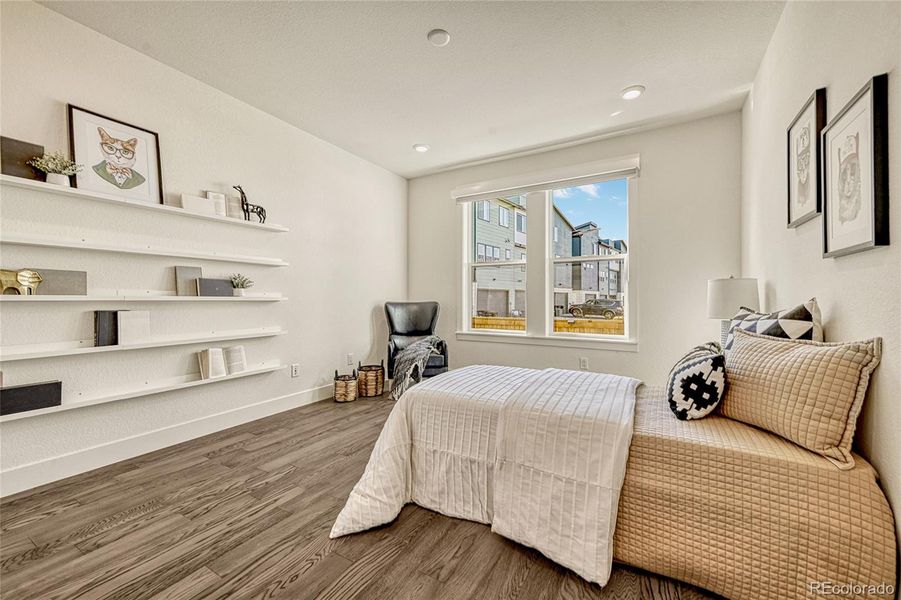 A second bedroom is found on the main level and offers luxury vinyl plank flooring, a large window allowing light to shine in, a walk-in closet and easy access to a bathroom.