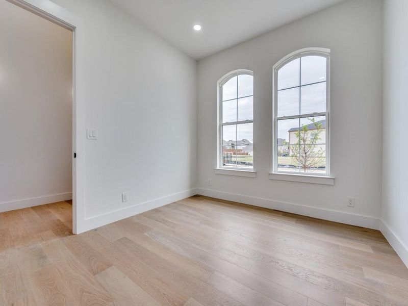 Spare room with light wood-type flooring