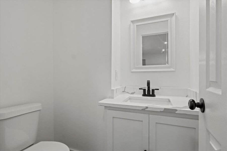 Bathroom with vanity and toilet