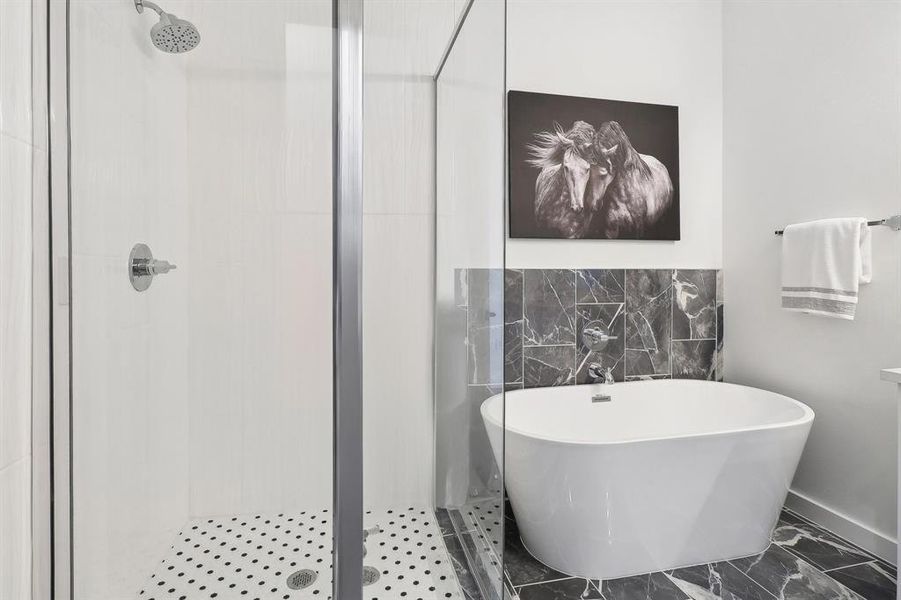 Bathroom featuring tile patterned flooring, tile walls, and independent shower and bath